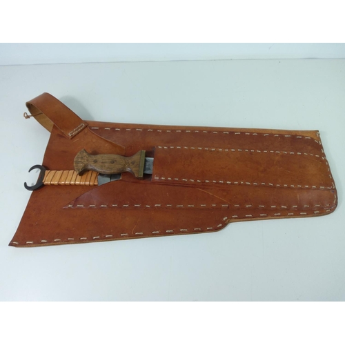 479 - Large leather carrying bag with 2 swords