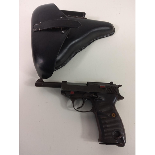 674 - Replica pistol with German Nazi emblems in leather holster