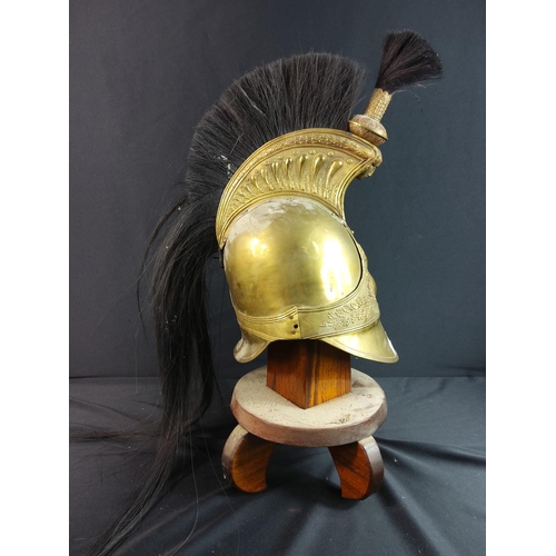 61 - Antique brass helmet with plume on stand