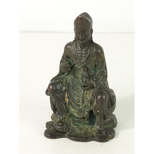 509 - Cast bronze oriental God figure