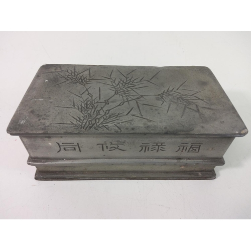 553 - Oriental pewter box and lid