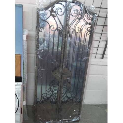 195 - Metal framed mirror, 130cms tall