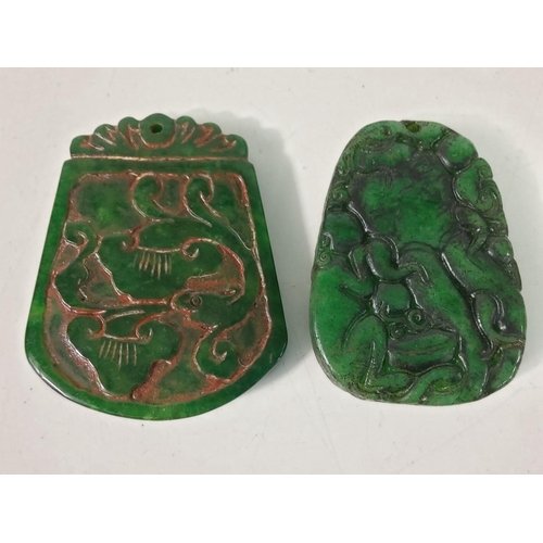 300 - 2 carved jade amulettes