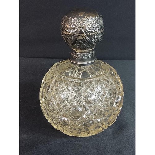 303 - Antique silver topped cut glass scent bottle