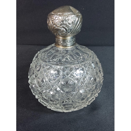 304 - Antique silver topped cut glass scent bottle