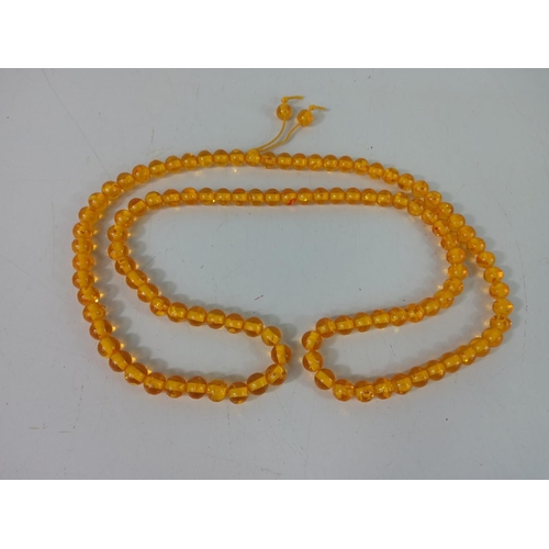 310 - Amber coloured beads