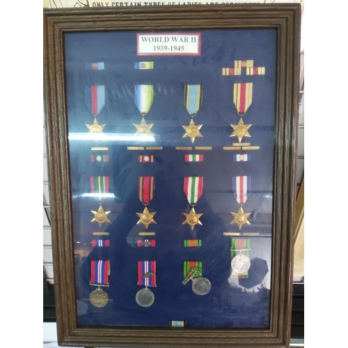 209 - Glass display case of 12 WWII medals, 62cms x 45cms