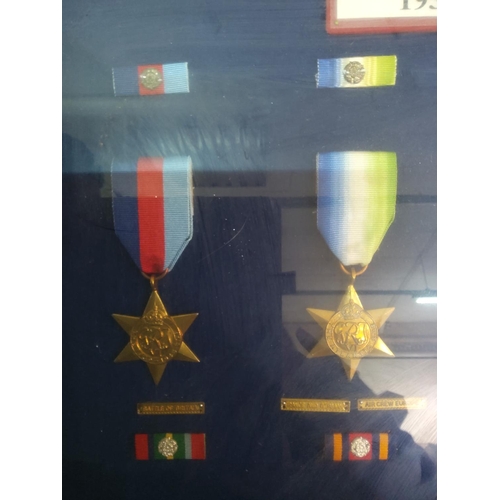 209 - Glass display case of 12 WWII medals, 62cms x 45cms