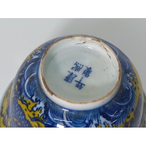 268 - Oriental yellow and blue dragon decorated cup