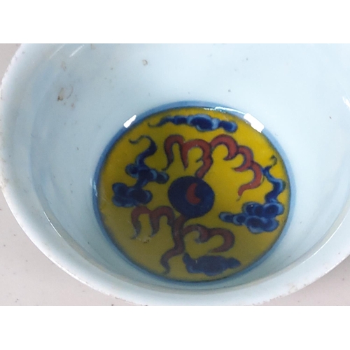 268 - Oriental yellow and blue dragon decorated cup