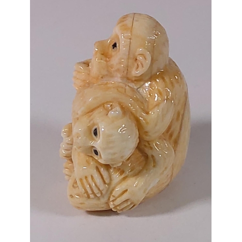 303 - Carved bone monkey figure