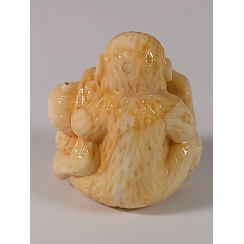 303 - Carved bone monkey figure