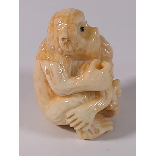 303 - Carved bone monkey figure