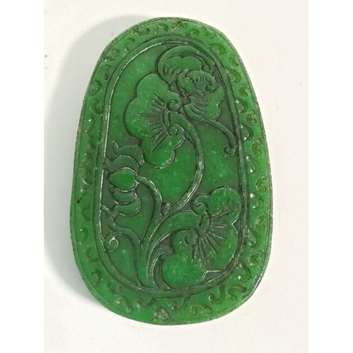 352 - Brown & green jade amulet decorated with horses, 10cms x 6cms