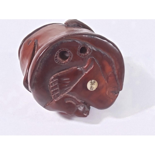 274 - Carved wooden signed netsuke