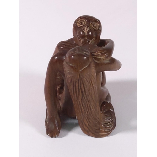 276 - Carved wood signed erotic netsuke