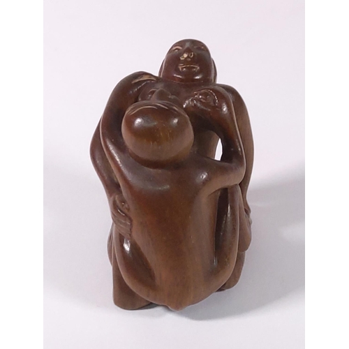 276 - Carved wood signed erotic netsuke