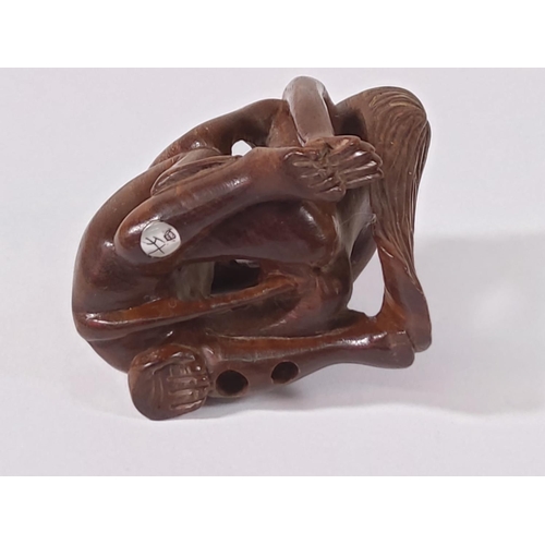 276 - Carved wood signed erotic netsuke