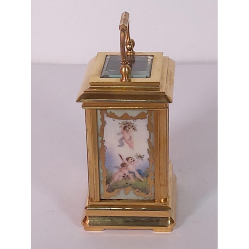 348 - Brass miniature carriage clock with porcelain panels