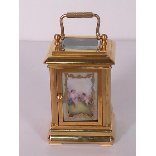 348 - Brass miniature carriage clock with porcelain panels