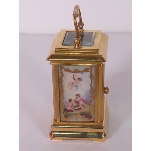 348 - Brass miniature carriage clock with porcelain panels