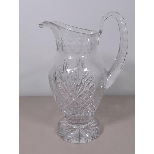 63 - Heavy cut glass water jug