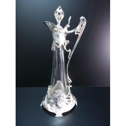 106 - Large glass and plated claret jug, 43cms in height