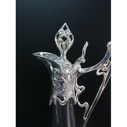 106 - Large glass and plated claret jug, 43cms in height