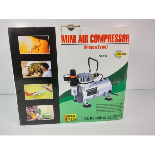 80 - Boxed mini compressor