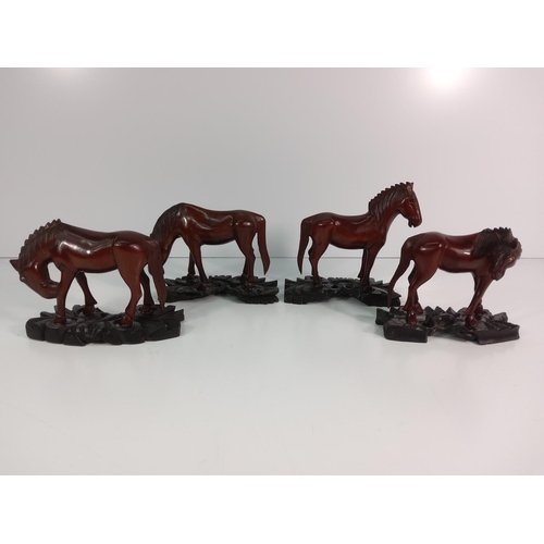 85 - 4 carved wooden horses