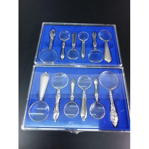 95 - 2 boxed sets of magnifying glasses