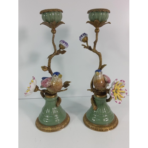 145 - Pair of gilt bronze and porcelain bird and flower candlesticks, 31cms in height