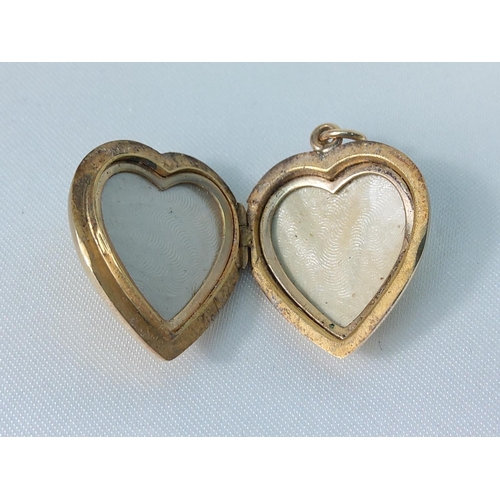 220 - 9ct gold heart shaped locket 4.7g