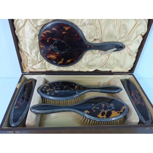 114 - Silver and tortoise shell mounted boxed 5 piece brush set