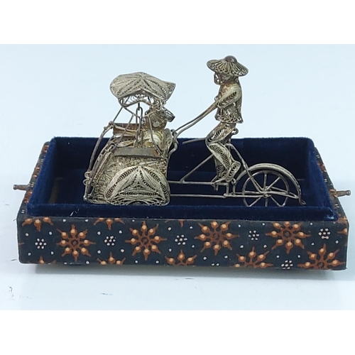 369 - Cased silver filigree Oriental rickshaw figure