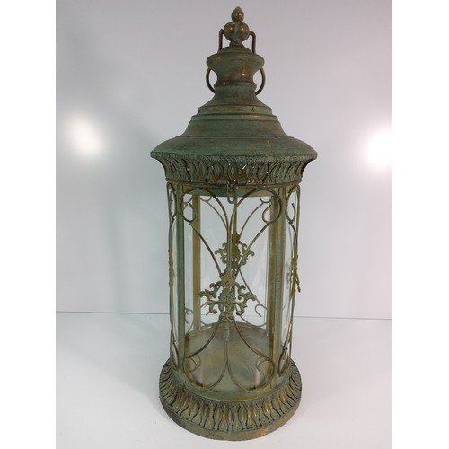 127 - Metal and glass lantern, 56cms in height