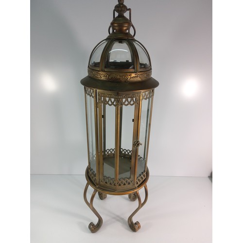 217 - Large ornate metal and glass dome topped lantern, approx 82cms in height