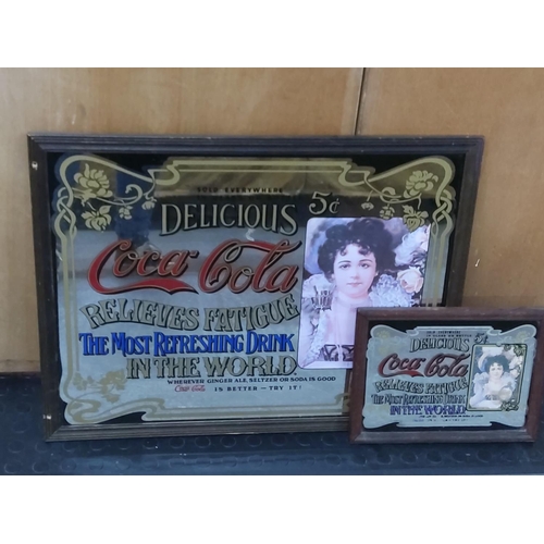 102 - 2 Coke Cola advertising mirrors, largest 65cms x 50cms