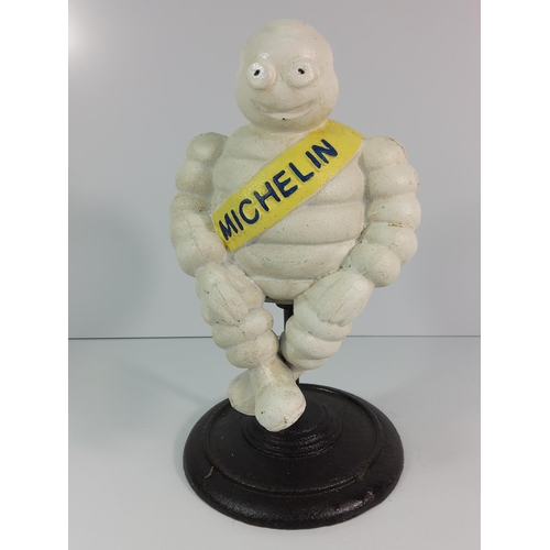 130 - Large cast metal Michelin man on stool