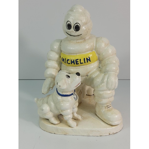 211 - Cast metal Michelin man and dog