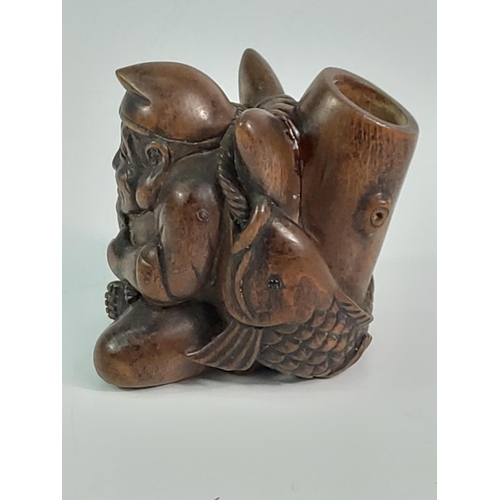 293 - Carved wooden candle holder