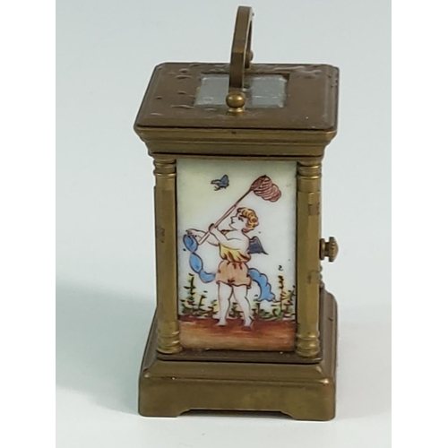 296 - Miniature carriage clock with porcelain panels