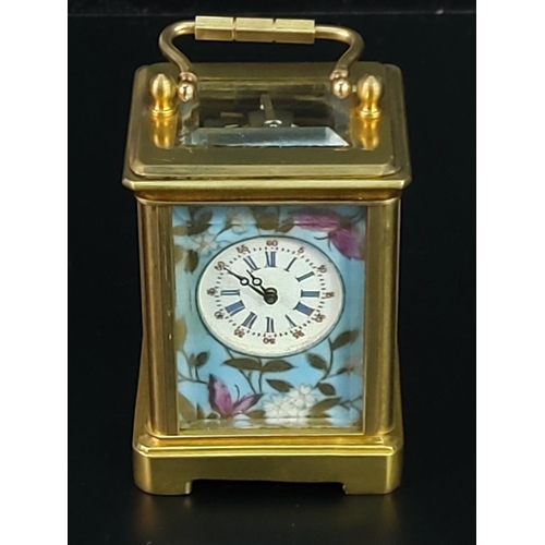 282 - Miniature carriage clock with porcelain panels and enamelled dial