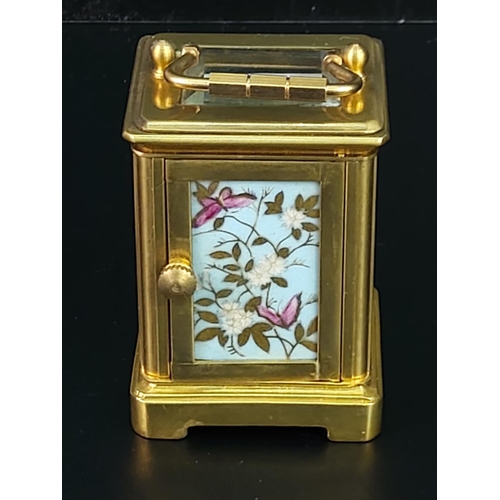 282 - Miniature carriage clock with porcelain panels and enamelled dial