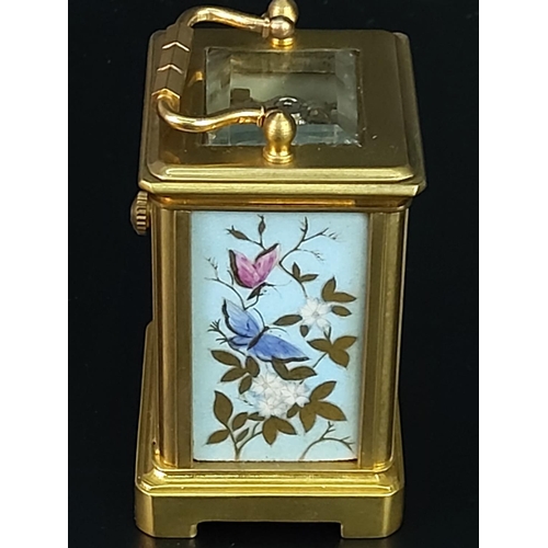 282 - Miniature carriage clock with porcelain panels and enamelled dial