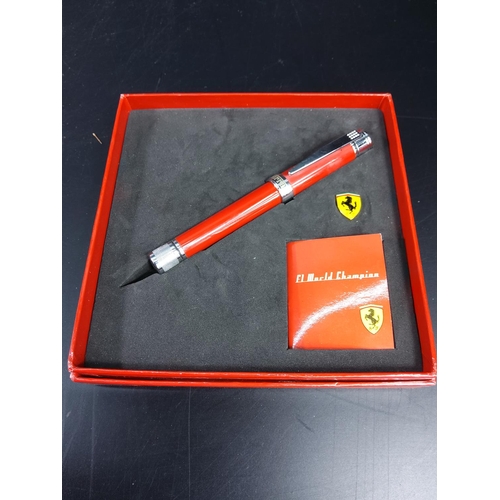 293 - Boxed Ferrari fountain pen and pin badge set