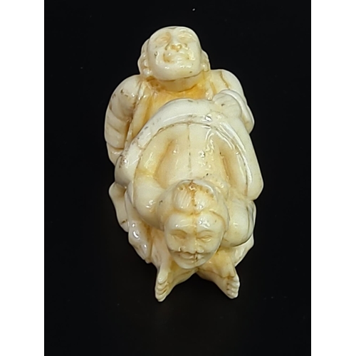 228 - Erotic carved bone netsuke