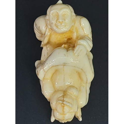 228 - Erotic carved bone netsuke