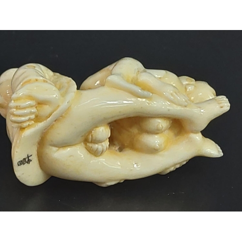 228 - Erotic carved bone netsuke