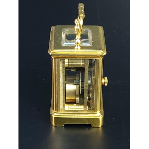 233 - Miniature brass carriage clock with enamelled dial